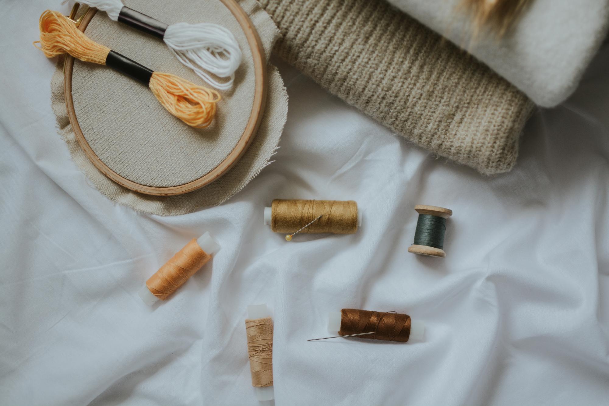 flatlay of embroidered goods and tags